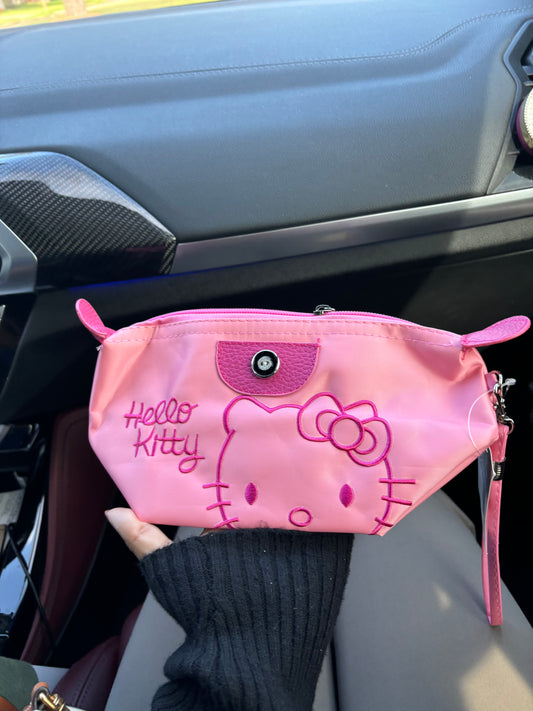 Pink Hello Kitty holding pouch💞🌸